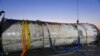 This photo provided by South Korea's Defense Ministry shows an object salvaged by South Korea's military that is presumed to be part of the North Korean space-launch vehicle that crashed into sea following a launch failure, in West Sea, South Korea, June 15, 2023. 