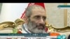 FILE- Frame grab from video released May 26, 2023, by IRINN of Assadollah Assadi, an Iranian released in a prisoner swap with Belgium, at Mehrabad airport in Tehran, Iran.