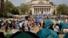 FILE - Student protesters gather inside their encampment on the Columbia University campus, on April 29, 2024, in New York.