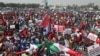 Des manifestants se rassemblent près de l'Assemblée nationale du Nigeria lors d'une manifestation à Abuja le 27 février 2024. (Photo Kola Sulaimon / AFP).