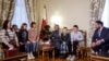 Duta Besar Qatar untuk Rusia, Sheikh Ahmed bin Nasser al-Thani dan Alexei Ghazaryan dari Kantor Komisaris Hak Anak Rusia, bertemu dengan anak-anak Ukraina dan anggota keluarga mereka di kedutaan Qatar di Moskow, 5 Desember 2023.
