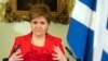 FILE - Nicola Sturgeon speaks during a press conference at Bute House in Edinburgh, Feb. 15 2023. Former Scottish first minister has been arrested by police investigating the finances of Scotland's pro-independence governing party.