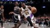 LeBron James (23) de des Los Angeles Lakers dribble Dennis Schroder (17) de Brooklyn, USA, le 31 mars 2024.
