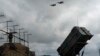 The Ukrainian Air Force's F-16 fighter jets fly over a Patriot Air and Missile Defense System in an undisclosed location in Ukraine, Aug. 4, 2024. 