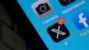 FILE - The X logo is seen on a smartphone screen in Los Angeles, Calif., on July 31, 2023.