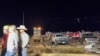 In this image made from video provided by KAMC/KLBK, people stand near debris in Matador, Texas, June 21, 2023, following storms went through the area. (KAMC/KLBK via AP)