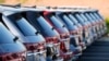 FILE - A long row of unsold 2024 Atlas utility vehicles is shown, July 28, 2024, at a Volkswagen dealership in Denver. 