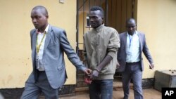 FILE - Collins Jumaisi Khalusha leaves court in Nairobi, Kenya, July 16, 2024. Khalusha, who police say confessed to killing 42 women, escaped Tuesday from a police station along 12 other inmates.