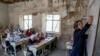FILE - A teacher leads a class of girls on the first day of the school year, in Kabul, Afghanistan, March 25, 2023.