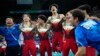 Members of Team Japan celebrate after winning the gold medal during the men's artistic gymnastics team finals round at Bercy Arena at the 2024 Summer Olympics, July 29, 2024, in Paris. 