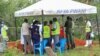 Forensic experts and homicide detectives from the Directorate of Criminal Investigations (DCI), gather to exhume bodies of suspected followers of a Christian cult named as 'Good News International Church', in Shakahola forest, Kenya, May 9, 2023.