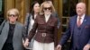 FILE - E. Jean Carroll, center, walks out of Manhattan federal court in New York, May 9, 2023. A federal judge on Tuesday said the New York writer can pursue a $10 million defamation case against the former U.S. president.