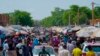 Pedestrians shop at a market in Niamey, Niger, July 24, 2024. One year has passed since a dramatic coup in Niger. 