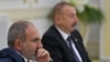 FILE - Armenia's Prime Minister Nikol Pashinyan, left, and Azerbaijan's President Ilham Aliyev attend a meeting of heads of the Commonwealth of Independent States in Ashgabat, Turkmenistan, October 11, 2019. The two will meet May 14, 2023, in Brussels.
