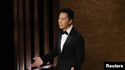港区中国全国政协委员甄子丹2023年3月12日出席奥斯卡金像奖颁奖典礼，一些活动人士反对他支持北京的言论。
