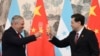 Honduras Foreign Minister Eduardo Enrique Reina Garcia, left, and Chinese Foreign Minister Qin Gang, raise a toast following the establishment of diplomatic relations between the two countries, at a ceremony in Beijing, March 26, 2023. (Greg Baker/Pool Photo via AP)