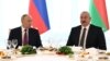 Russian President Vladimir Putin, left, and Azerbaijani President Ilham Aliyev attend a state reception at the Gulustan Palace in Baku, Azerbaijan, Aug. 19, 2024. (Sputnik via AP)