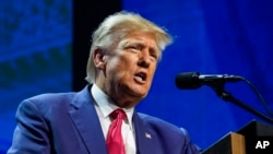 FILE - Former President Donald Trump speaks at the National Rifle Association Convention in Indianapolis, April 14, 2023. Federal prosecutors have notified Trump's attorneys he is the target of an investigation into his handling of classified materials, say sources.