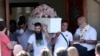 Pall bearers carry the coffin of stabbing victim Alice da Silva Aguiar after her funeral service at St. Patrick's Church in Southport, England, Aug. 11, 2024.