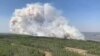 In this photo provided by the Government of Alberta Fire Service, a wildfire burns a section of forest in the Grande Prairie district of Alberta, Canada, May 6, 2023. 