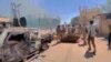 RSF fighters stand near the damaged Air Defence Forces command centre in Khartoum, Sudan May 17, 2023, in this screen grab obtained from a social media video.