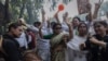 Supporters of India's main opposition Congress party celebrate after the initial poll results in Karnataka elections at the party headquarters, in New Delhi, May 13, 2023.