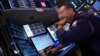 Specialist Anthony Matesic works at his post on the floor of the New York Stock Exchange, Aug. 5, 2024.