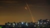 Russian rockets launching against Ukraine from Russia's Belgorod region are seen at dawn in Kharkiv, Ukraine, May 14, 2023. 