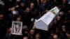 Mourners from the Druze minority carry the coffins of some of the 12 children and teens killed in a rocket strike at a soccer field during their funeral, in the village of Majdal Shams, in the Israeli-annexed Golan Heights, July 28, 2024. 