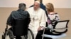 In this image distributed by Vatican Media, Pope Francis visits the Pediatric Oncology ward of the Agostino Gemelli University Polyclinic in Rome, June 15, 2023. 