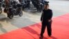FILE - North Korea's leader Kim Jong Un walks to meet Russian President Vladimir Putin at Pyongyang Sunan International Airport outside Pyongyang, June 19, 2024. 