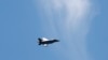 FILE - A fighter jet flies over Washington, June 12, 2019. Military planes were scrambled Sunday over the U.S. capital after a light aircraft violated its airspace and later crashed in southwestern Virginia.