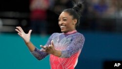 Simone Biles, of the United States, celebrates after completing her routine in the women's artistic gymnastics individual floor exercise finals at Bercy Arena at the 2024 Summer Olympics, in Paris, France, Aug. 5, 2024.