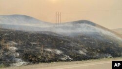 FILE - This image provided by the Oregon Department of Transportation shows an area burned by the Durkee fire near Interstate 84 close to Huntington, Oregon, July 23, 2024.