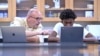 History teacher Matt Brophy works with Flerentin “Flex” Jean-Baptiste, 16, of Medford, Mass., on making up late assignments during summer school at Medford High School, Friday, Aug. 2, 2024.