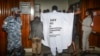FILE - An Ugandan lawmaker wears clothes with an anti-LGBTQ message as he enters the Parliament building to vote on a harsh new anti-gay bill, in Kampala, March 21, 2023. Uganda's President Yoweri Museveni signed the bill into law on May 29, 2023.