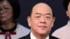 FILE - Macao Chief Executive Ho Iat Seng arrives for the inauguration ceremony in Macao, Dec. 20, 2019, marking the 20th anniversary of the former Portuguese colony's handover to Chinese rule. 