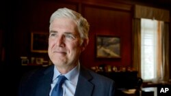 U.S. Supreme Court Justice Neil Gorsuch poses for a portrait in his office at the Supreme Court, in Washington, July 29, 2024.