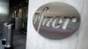 FILE - The Pfizer logo identifies the pharmaceutical company's headquarters in New York, Nov. 9, 2020.
