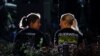 Members of the fire department speak as they work following an incident in which several individuals were killed on Friday night when a man randomly stabbed passers-by with a knife at a city festival, in Solingen, Germany, Aug. 24, 2024.