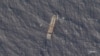 Gambar selebaran tak bertanggal yang dirilis oleh Planet Labs PBC pada tanggal 27 November 2023 ini menunjukkan foto kapal tanker Sky Venus yang berlayar melalui Selat Taiwan pada bulan September 2021, dan diduga terlibat dalam transfer minyak selundupan. (Planet Labs PBC / AFP)