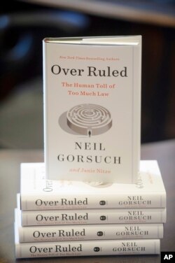 Copies of U.S. Supreme Court Justice Neil Gorsuch's book "Over Ruled: The Human Toll of Too Much Law" are seen in Washington, July 29, 2024.