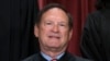 FILE - Associate Justice Samuel Alito joins other members of the Supreme Court as they pose for a new group portrait, at the Supreme Court building in Washington, Oct. 7, 2022. 