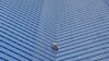 "Spiderman" Prancis Alain Robert memanjat gedung pencakar langit "Tour TotalEnergies Coupole" untuk menyerukan "Perdamaian di Timur Tengah" di Puteaux di distrik keuangan La Defense di Puteaux, dekat Paris, Prancis hari Senin (6/11). (Reuters) 
