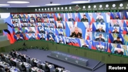 Министр обороны России Сергей Шойгу проводит совещание в Национальном центре управления обороной в Москве
