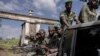 Batomboki ba lingomba M23 bazali kolongwa na camp ya basoda ya Rumangambo, na Rutshuru, Nord-Kivu, o'mokolo mwa 6 sanza ya yambo 2023. (Photo.Guervhom Ndebo/AFP)