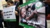 Children and Lebanese activists from the Islamic group Jamaa Islamiya hold a sit-in in solidarity with the Syrian besieged town of Madaya, outside the International Committee of the Red Cross (ICRC) headquarters in the Lebanese capital Beirut, Jan. 8, 2016.