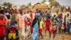 FILE - Refugees are seen gathered at Minawao camp in northern Cameroon, April 18, 2016. The U.N. refugee agency has called on Cameroon to stop forcibly repatriating Nigerian refugees on its territory. 