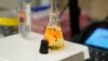 FILE - A water sample is measured as part of a PFAS drinking water treatment experiment, Feb. 14, 2023, at the U.S. Environmental Protection Agency in Cincinnati.