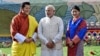 འབྲུག་གི་རྒྱལ་པོ་འཇིགས་མེད་གེ་སར་རྣམ་རྒྱལ་དབང་ཕྱུག་དང་རྒྱ་གར་གྱི་སྲིད་བློན་ནེ་རན་ཌ་མོ་དྷི་ བཙུན་མོ་ཨ་ཞེ་རྗེ་བཙུན་པདྨ་བཅས། ༢༠༡༤